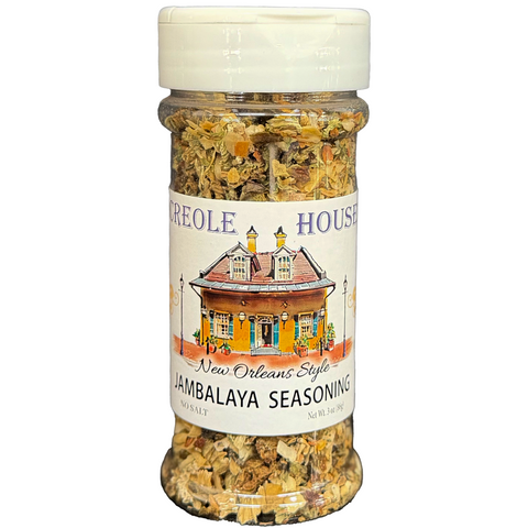 A clear plastic spice shaker filled with New Orleans Style Jambalaya Seasoning, featuring a white cap and a white label with an illustration of a New Orleans house. The brand name 'Creole House' is visible on the label.