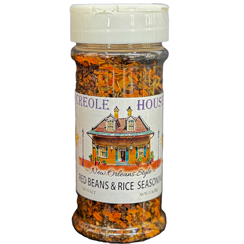 A clear plastic spice shaker filled with New Orleans Style red beans and rice seasoning, featuring a white cap and a white label with an illustration of a New Orleans house. The brand name 'Creole House' is visible on the label.